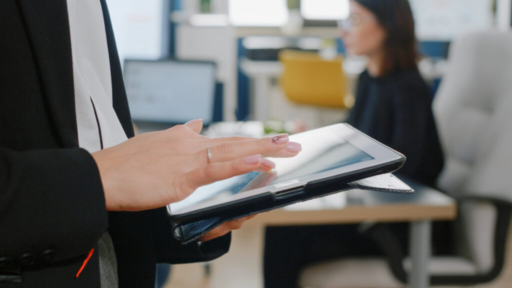 close-up-woman-holding-digital-tablet-with-touch-screen-business-project-woman-with-corporate-job-using-modern-gadget-work-management-marketing-strategy-office